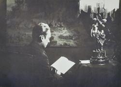 Евгений Иванович Чарушин (1901-1965), писатель, за чтением книги в своем кабинете. [1920-е гг.]. г. Вятка.